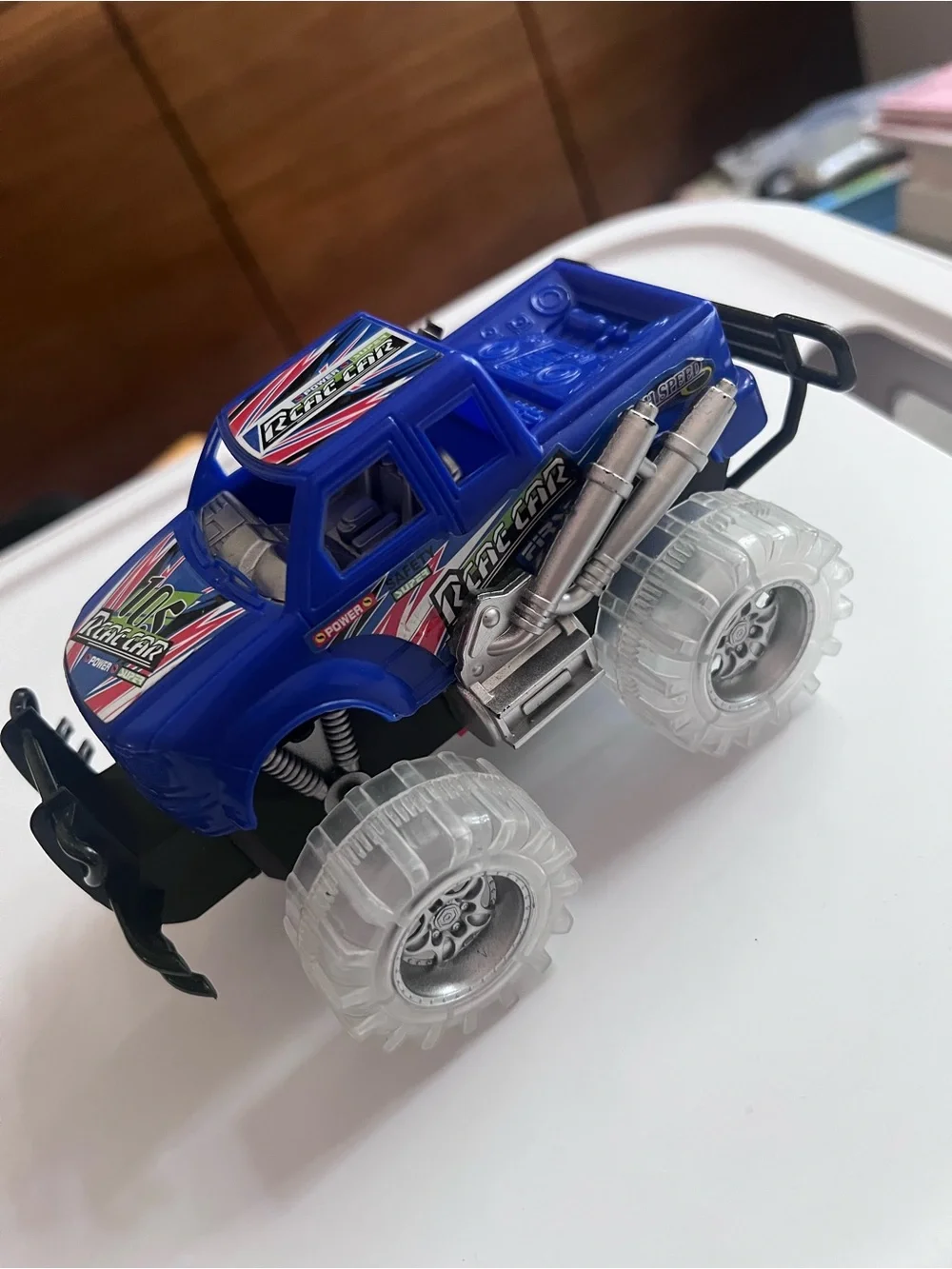 Light-Up Blue Monster Truck Toy – Friction Powered Push & Go Car with LED Tires